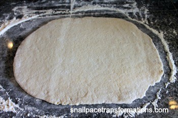 roll dough out for stuffed pizza bread