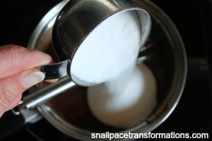 pouring the sugar into the chocolate peppermint sauce
