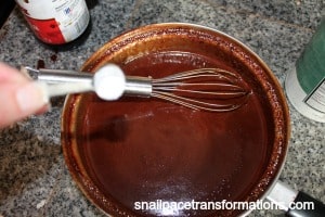 stiring in the last of the ingredients for chocolate peppermint syrup
